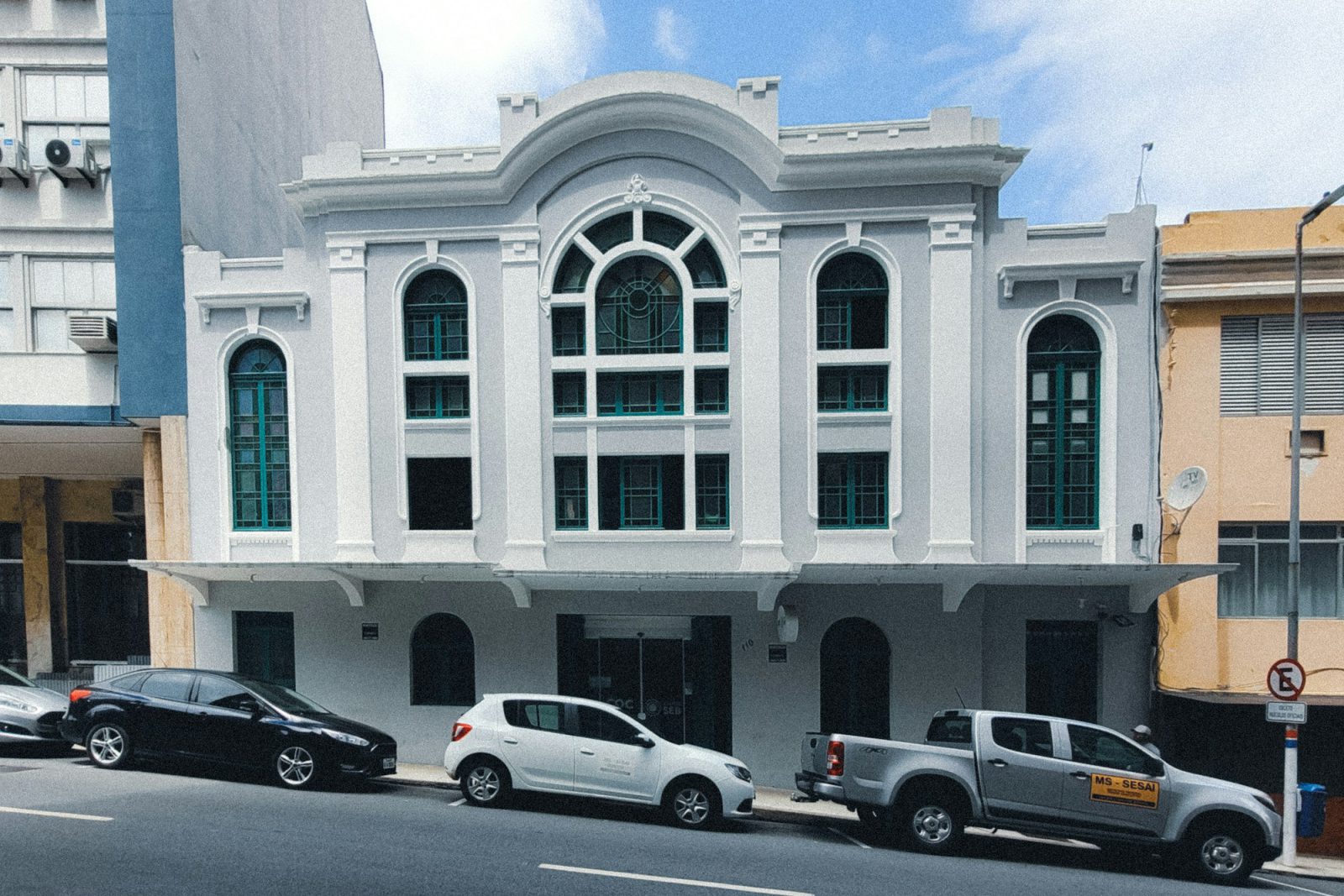 Ground-floor retail building on historic Flagler Street — the 1925 masonry building