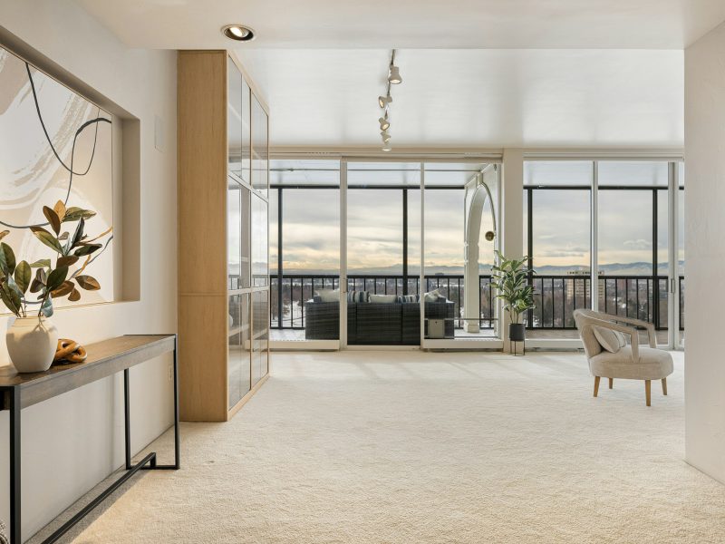 Sky-garage condo with ocean-to-bay views — living room
