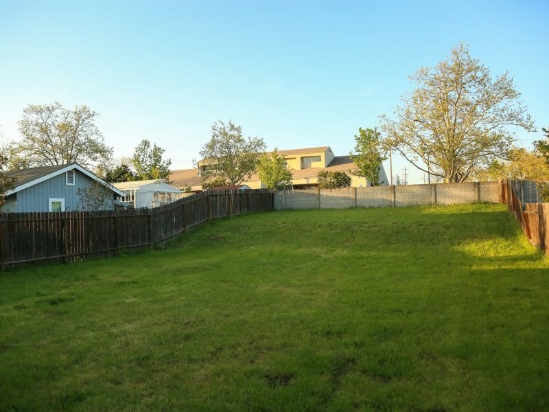 Buildable estate lot on Tigertail Avenue — fenced street frontage