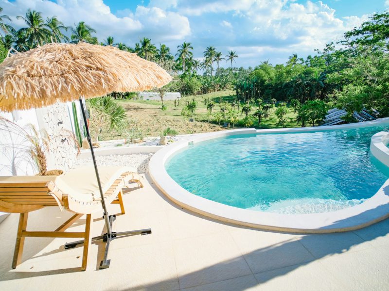 Normandy Isle waterfront ranch with a private dock — pool and garden