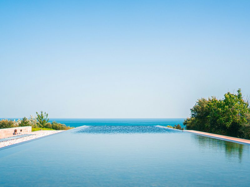 Riviera villa with a heated pool and summer kitchen — pool and garden