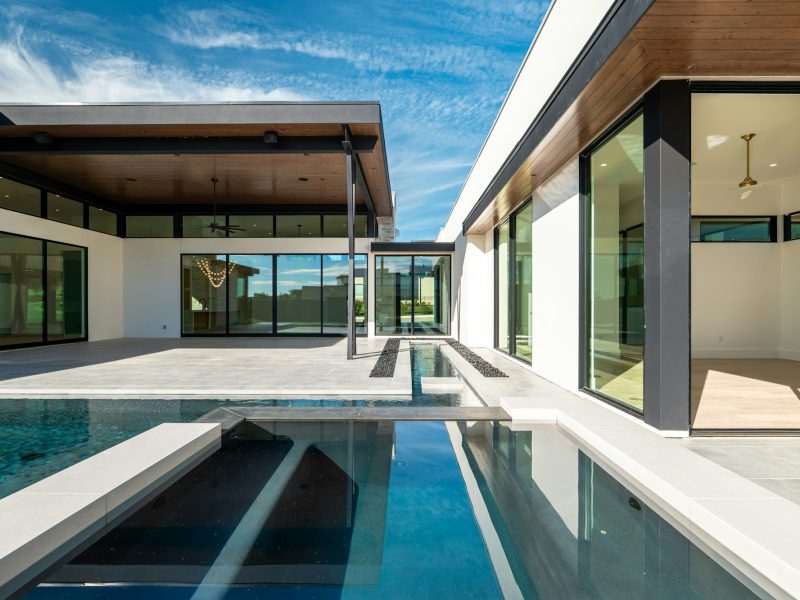 Di Lido Island waterfront with 75 feet of dockage — pool and garden