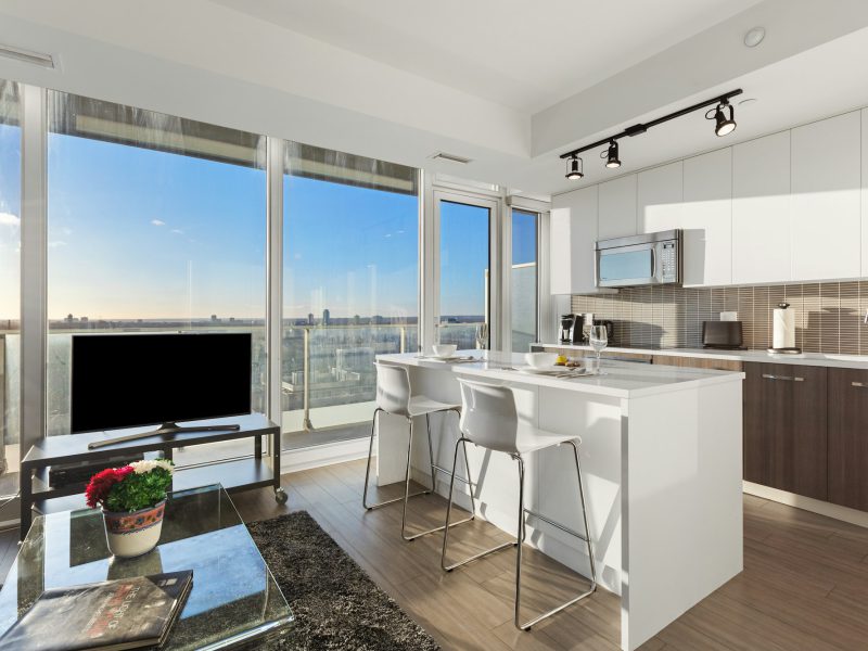 Bayfront two-bedroom with marina and Dinner Key views — living room