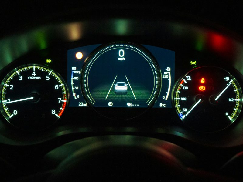 An illuminated car dashboard.