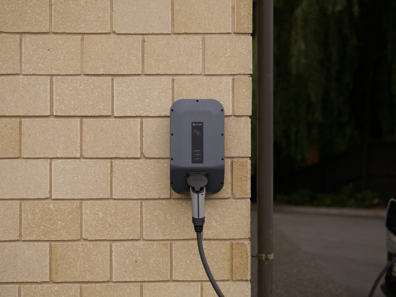 Black charger plugged in on socket