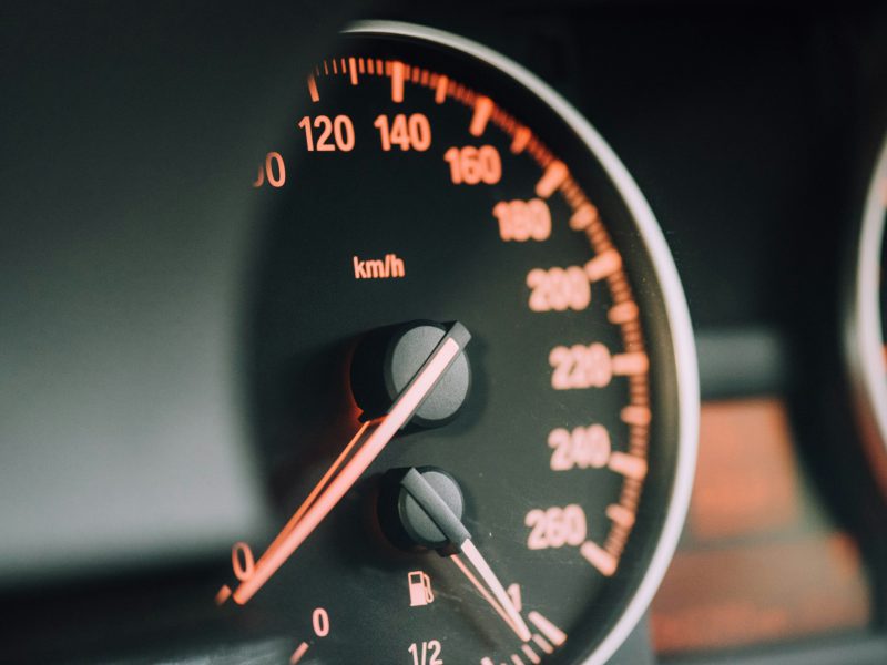 Closeup photo of black analog speedometer