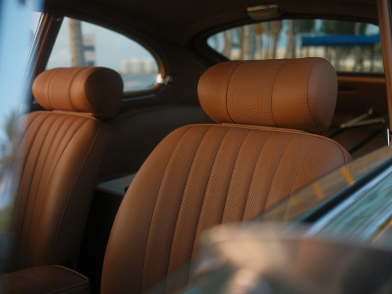 The interior of a car with brown leather seats
