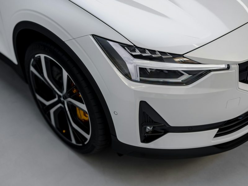 White electric car front corner with LED headlight