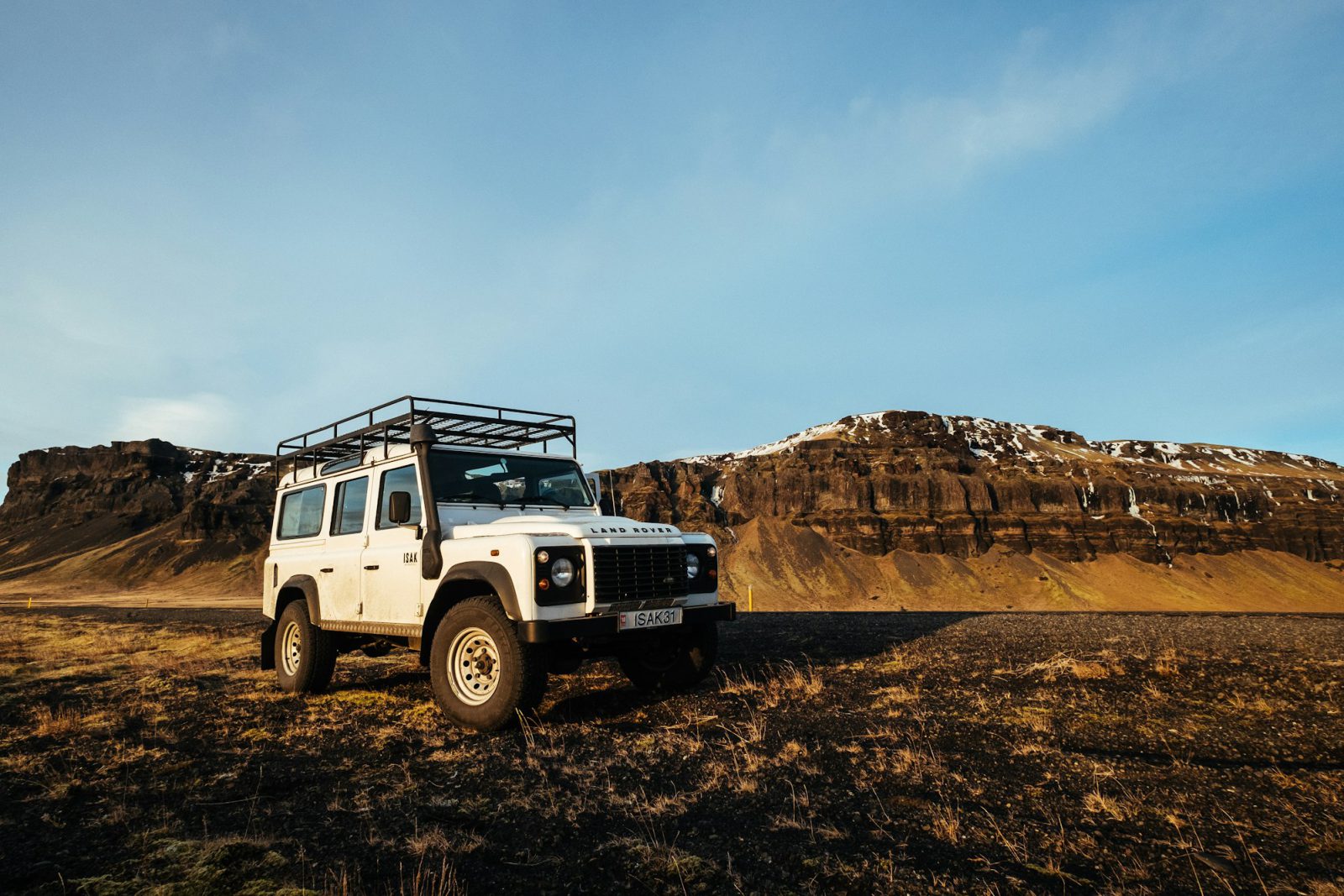 White Land Rover Defender, front three-quarter view
