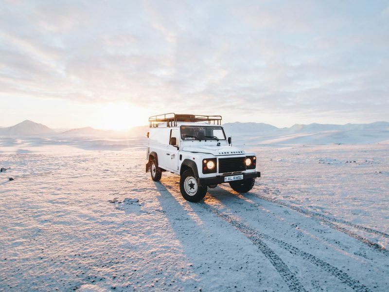 White Land Rover Defender, front three-quarter view