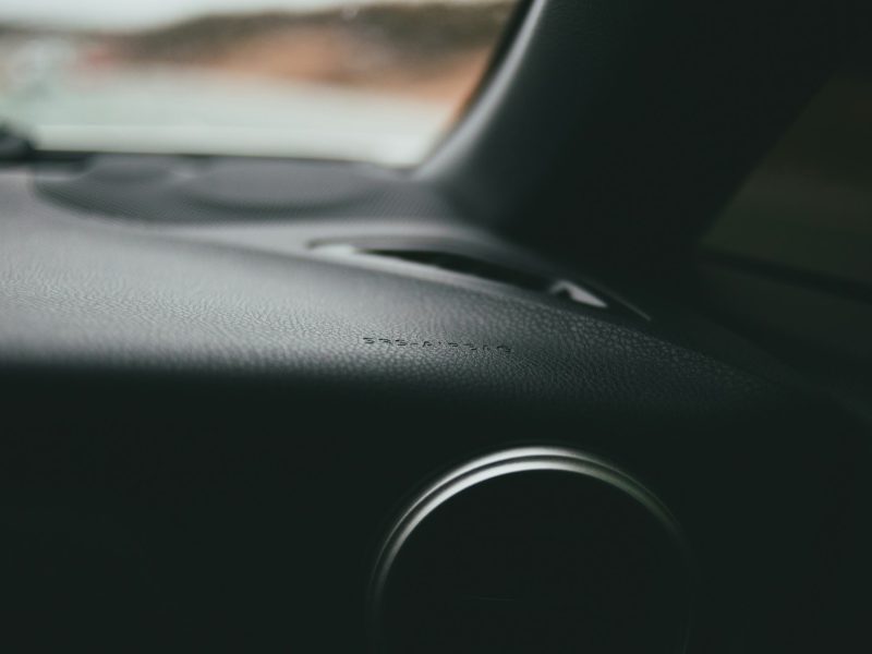 Black car dashboard during daytime