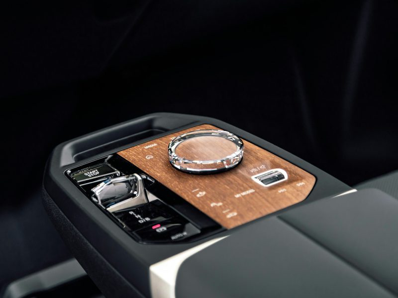 BMW iX interior detail: crystal gear selector and iDrive controller
