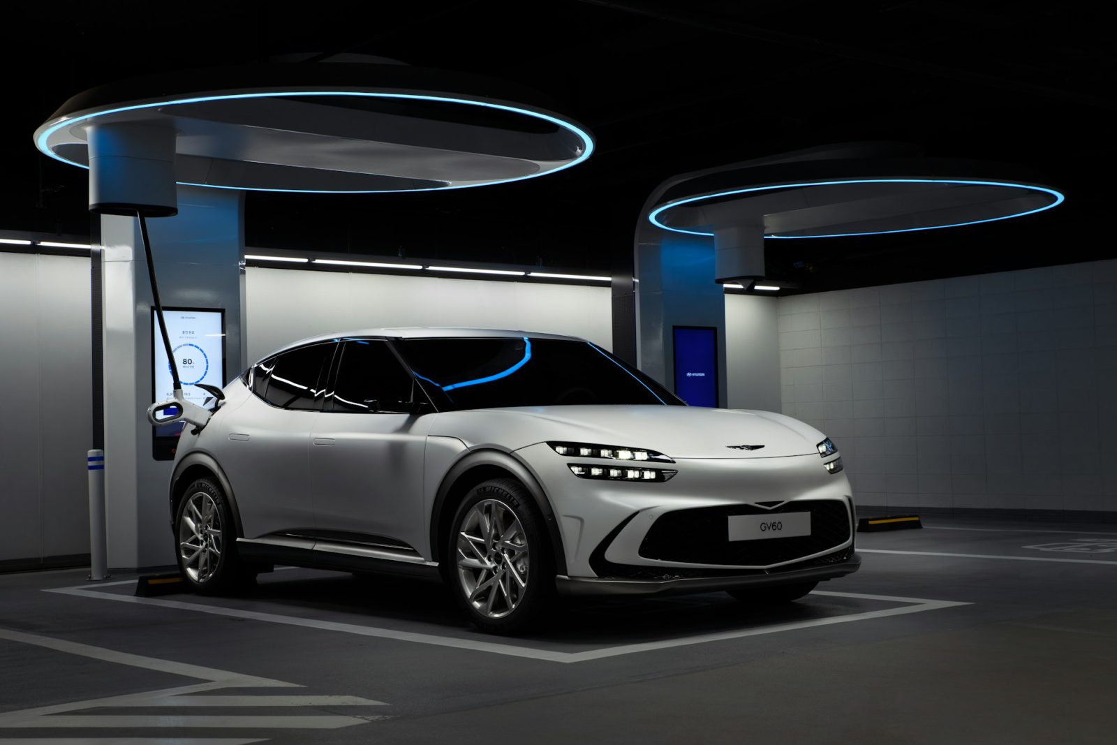 Electric crossover at a covered fast-charging station