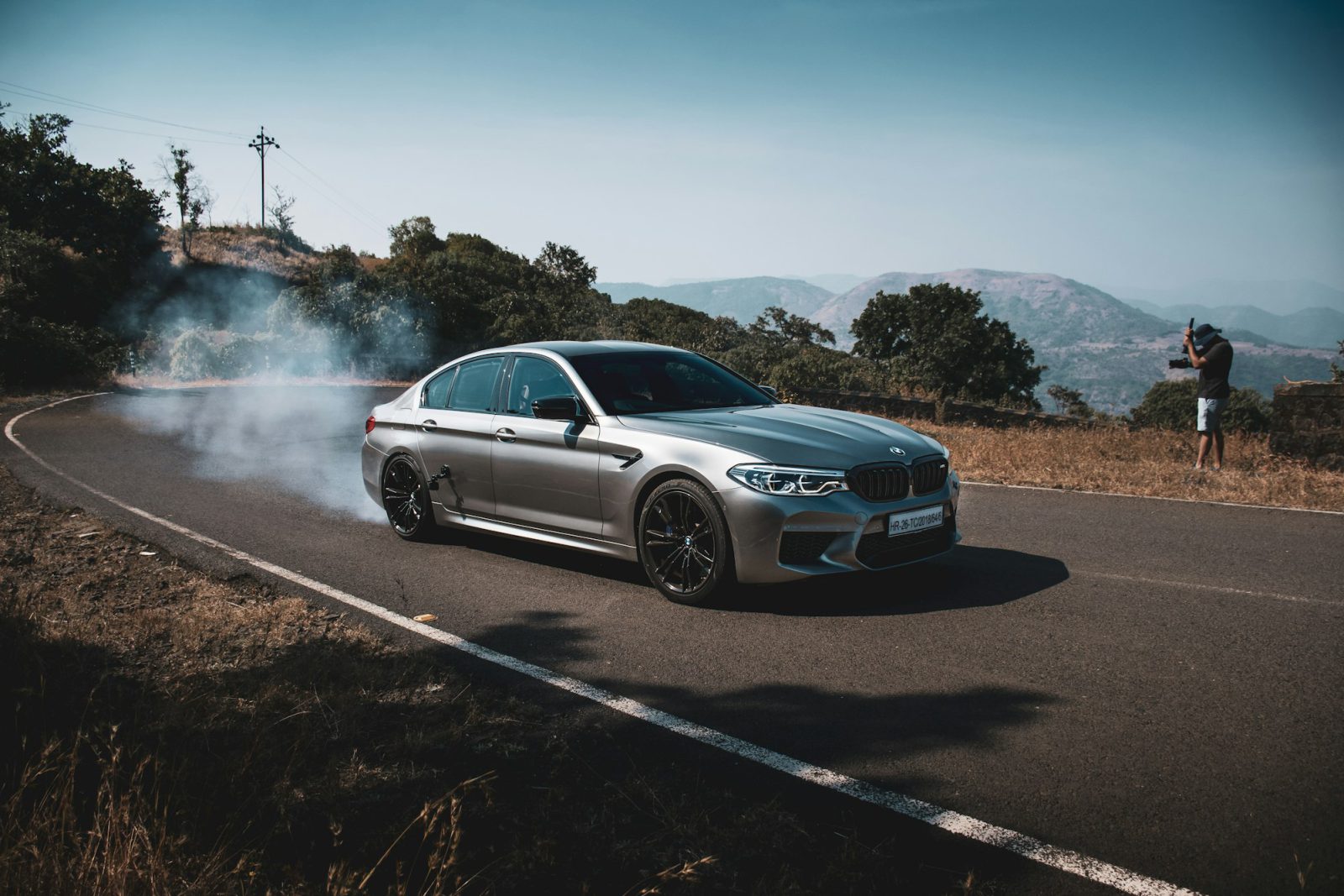 Gray BMW M5, front three-quarter view