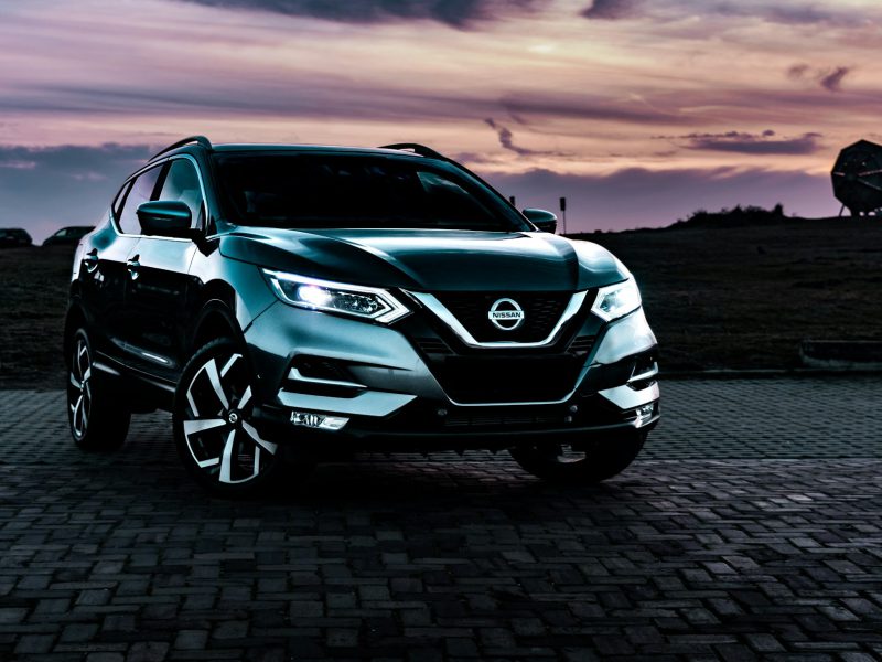 Gray Nissan Rogue Sport, front three-quarter view