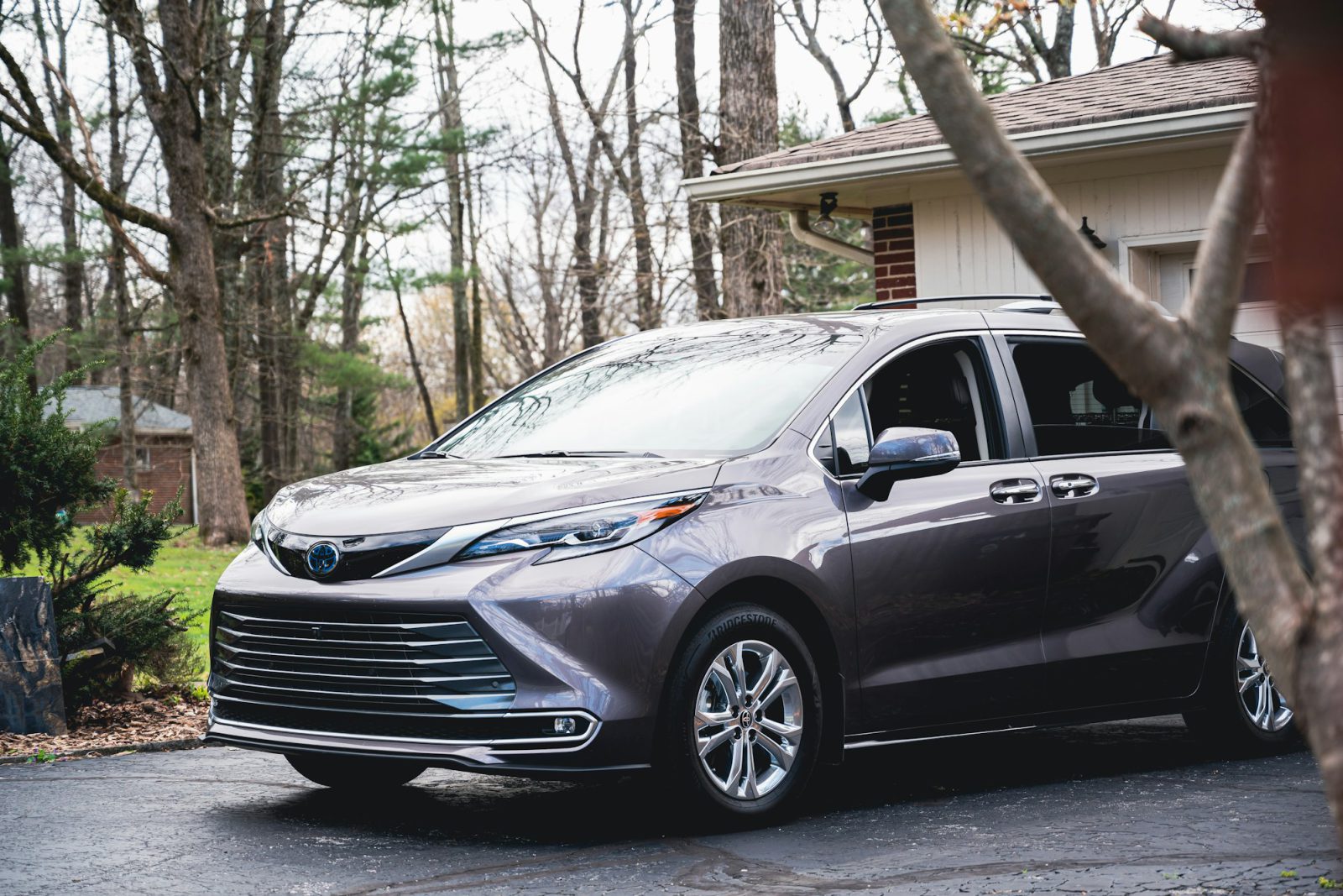 Gray Toyota Sienna, front three-quarter view