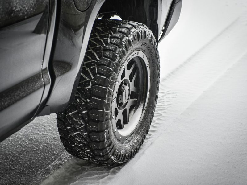 Grayscale photo of car wheel