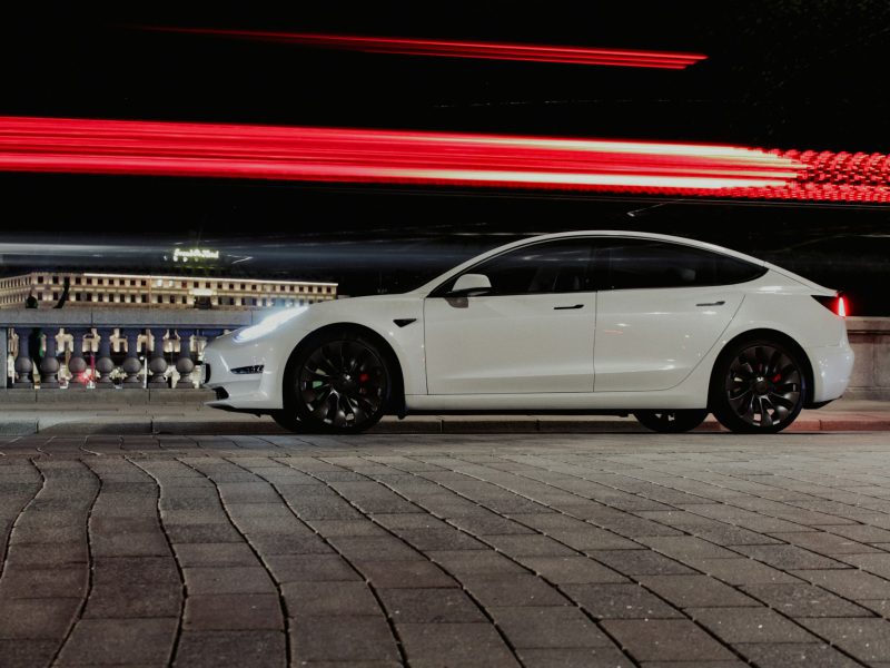 White Tesla Model 3, side profile