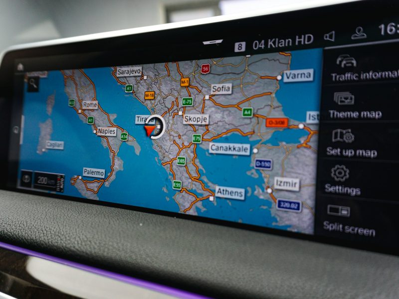 A car dashboard with a map on it