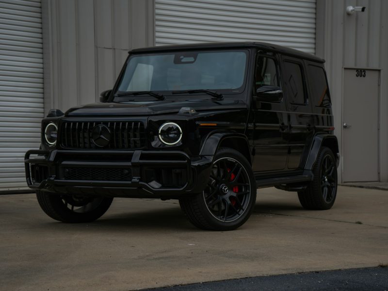 Black Mercedes-Benz G-Class, front three-quarter view