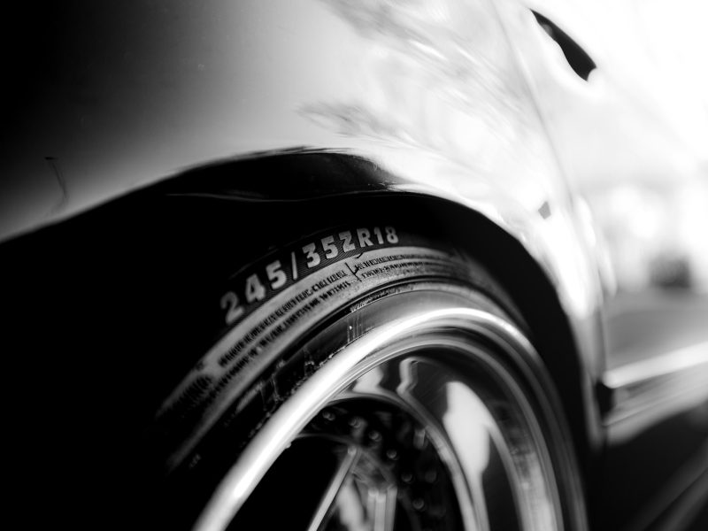 Close-up of a car tire with size markings