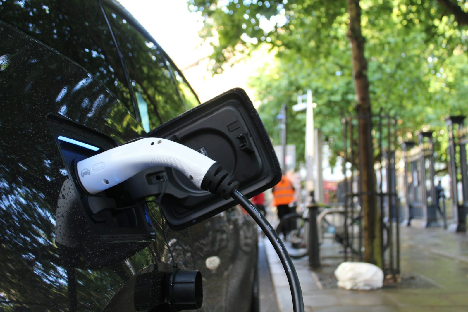 Electric car charging on a city street