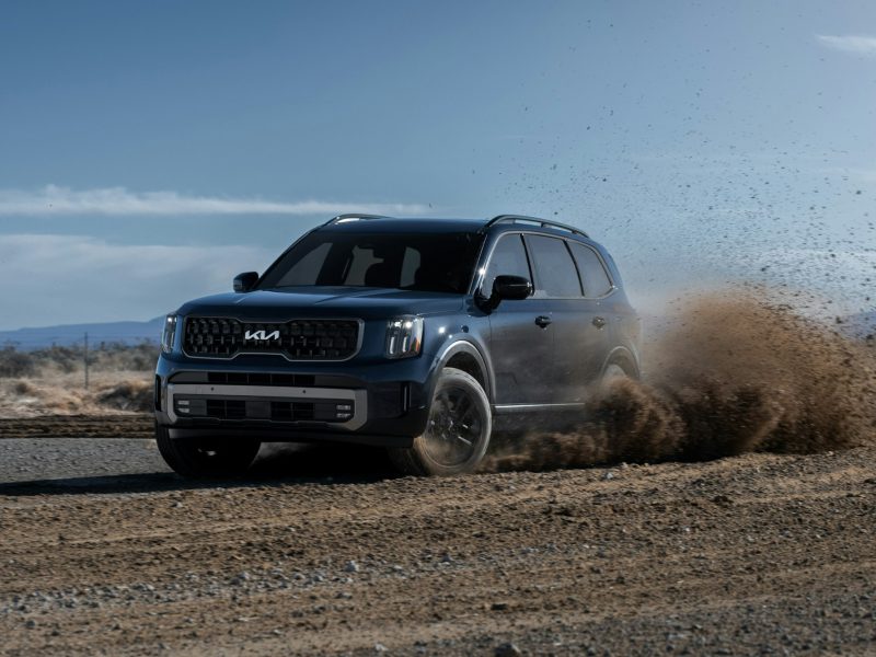 Blue Kia Telluride, front three-quarter view