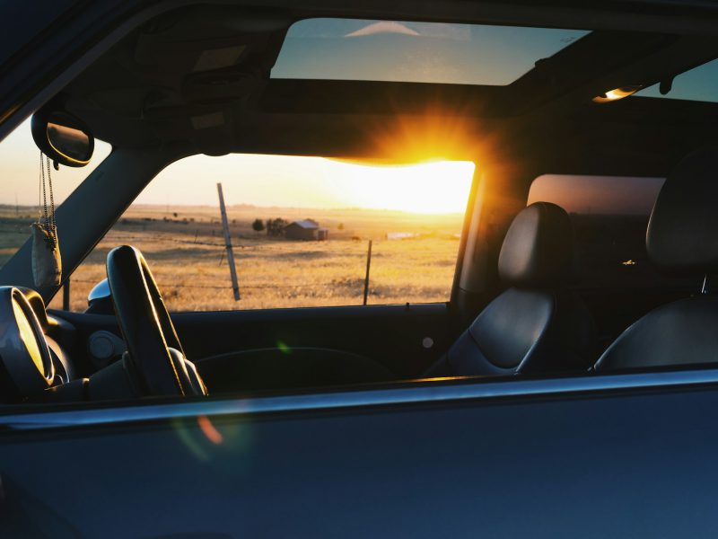 Car interior with leather seats in countryside