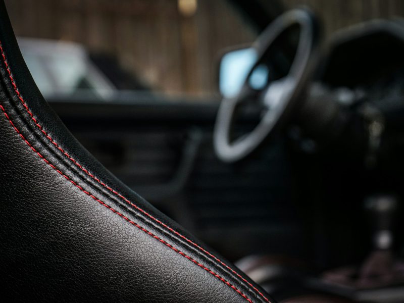 Selective focus photography of black vehicle interior