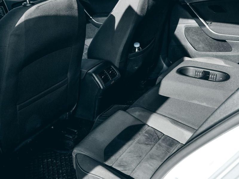 A black and white photo of the interior of a car