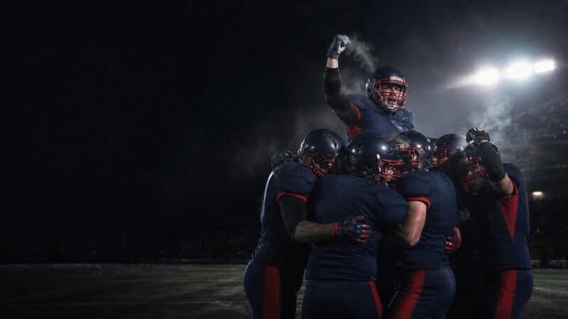 A navy and red defence celebrates a narrow win on a cold night.