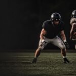 A linebacker squares up a ball carrier in open space.