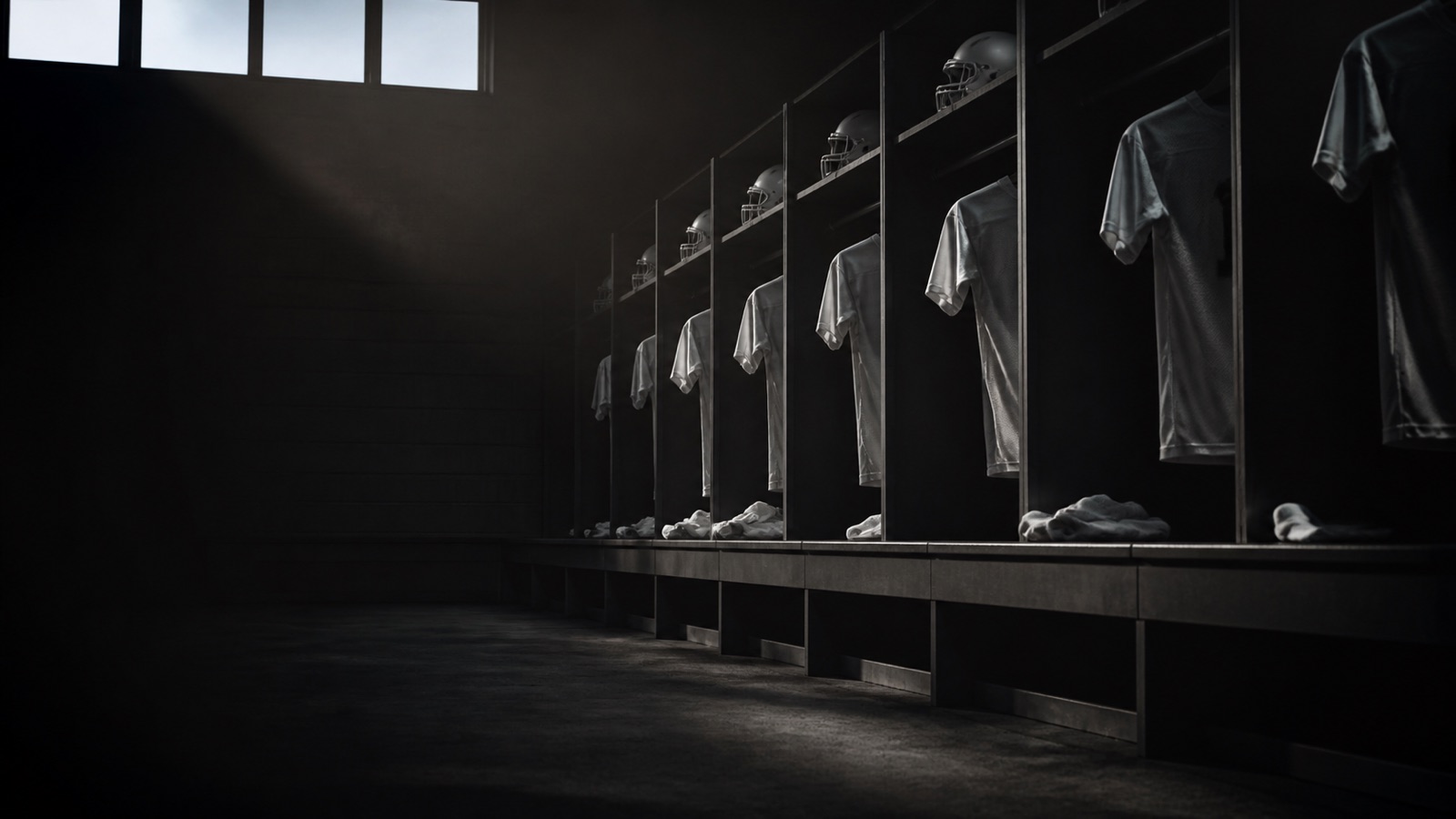 An empty locker room with kit hung and still.