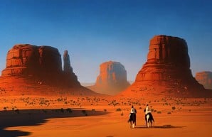 2 Cowboys Riding Along the Sandy Deserts