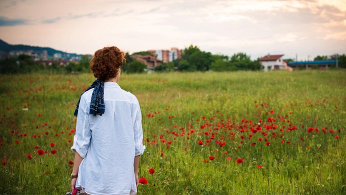 Post with a picture of a girl watching the sunset
