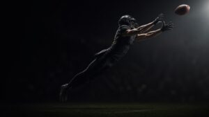 A receiver stretches for the ball mid-route.