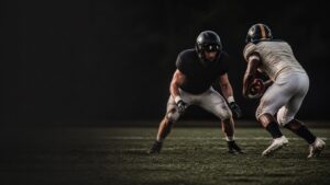 A linebacker squares up a ball carrier in open space.