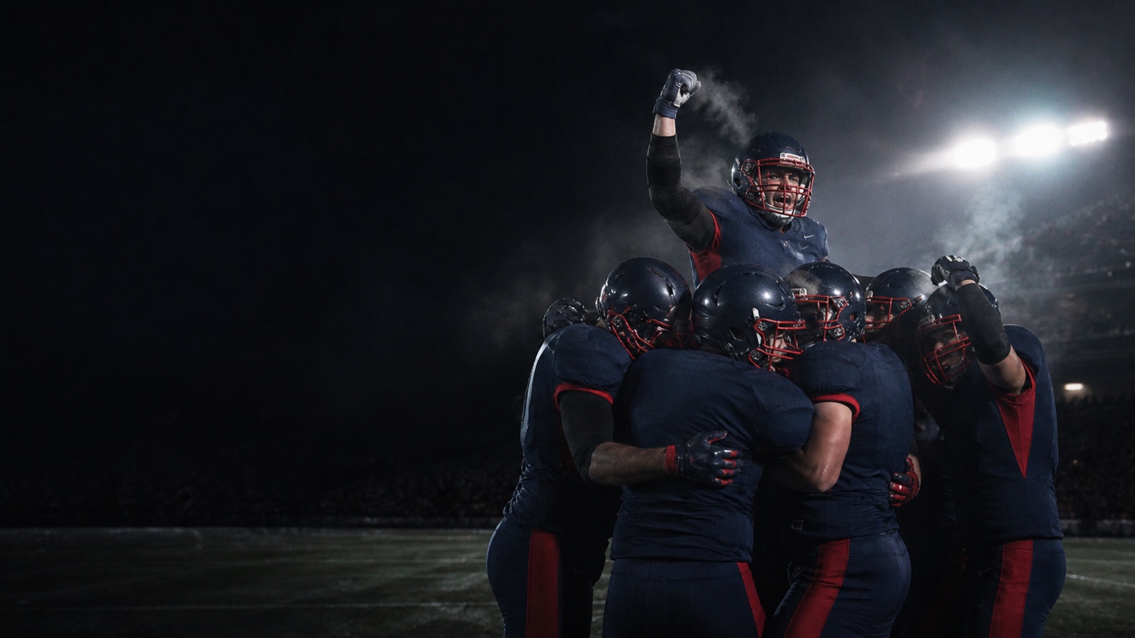A navy and red defence celebrates a narrow win on a cold night.